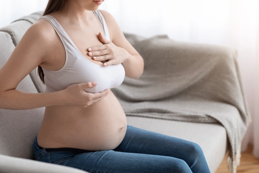 pregnant-lady-massaging-her-breastsnull
